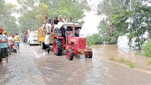 Punjab floods tractors rescue Tractors lifeline in Punjab floods Farmers rescue villagers Punjab flood Punjab flood relief operations Over 1000 villages affected Punjab floods